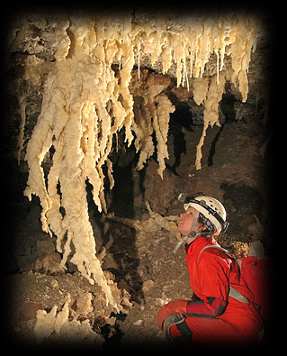A caver admires rare and delicate formations. (Photo: Bern Szukalski)